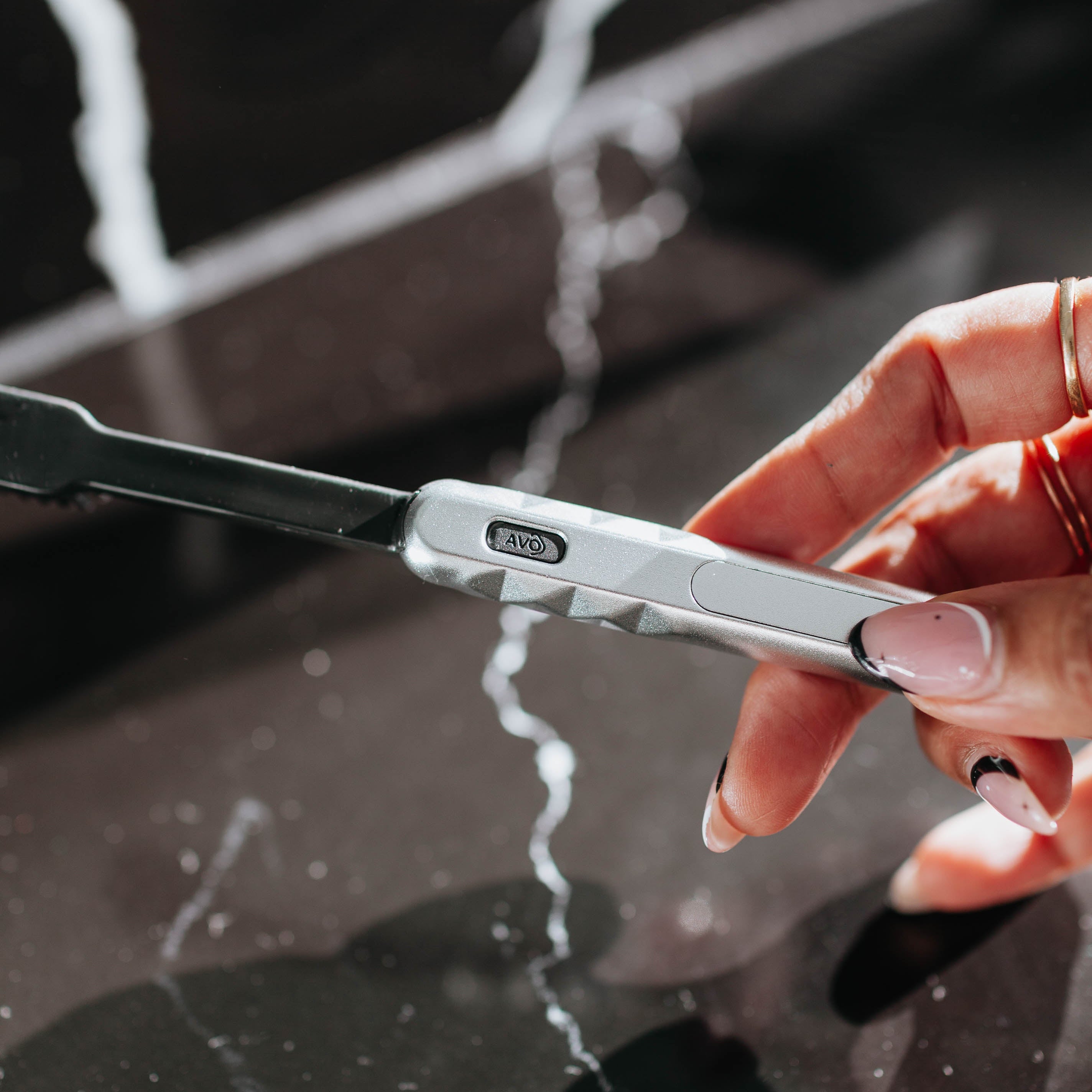 Starter Kit Silver Aluminum Brush Handle and Biodegradable Brush presented in Hand