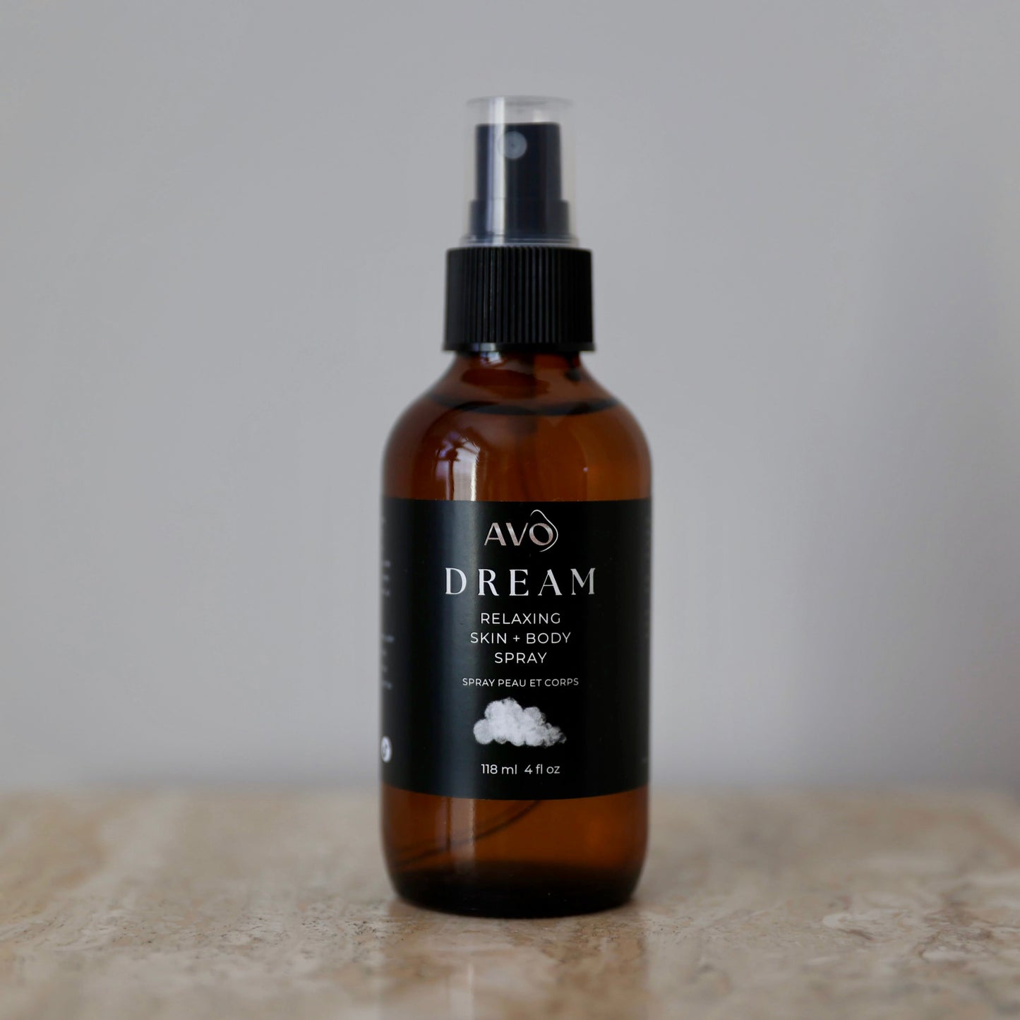 bottle facing forward is Avo's Dream skin and Relaxing Spray made with Organic Simmondsia Chinensis (Jojoba) Oil Steam distilled organic essential oil blend